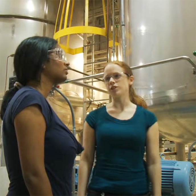 two women on a chemical production facility tour